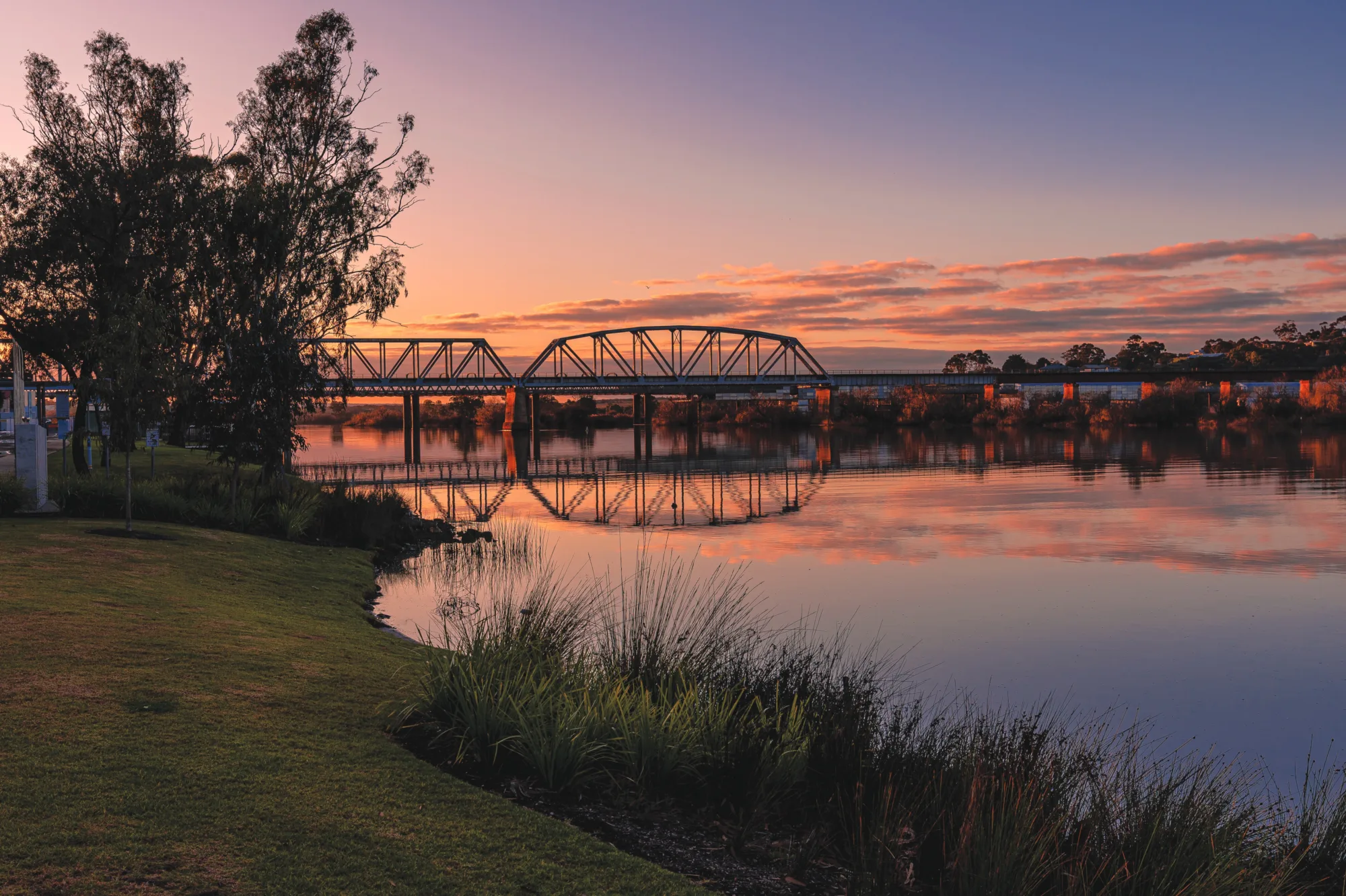 Murray Bridge over the river at sunset